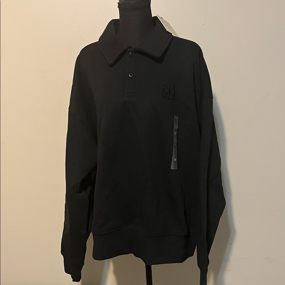Calvin Klein Heavyweight CK Emblem Polo Sweatshirt in black.